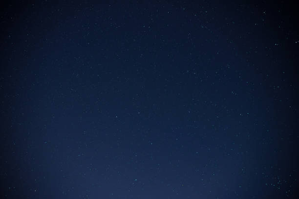 istock Beautiful milky way on a dark night sky with stars 848942318