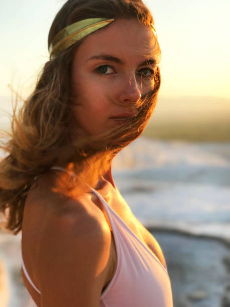 istock Beautiful woman at gold sunset light 848943562