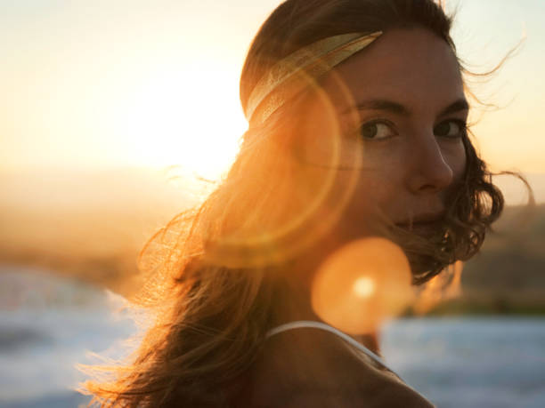 istock Beautiful woman at gold sunset light 848943576