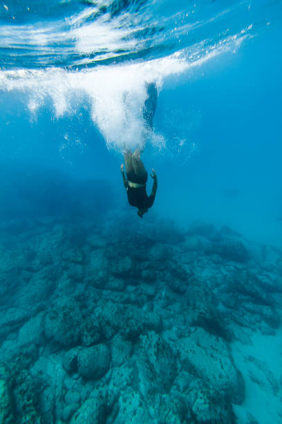 istock Man free diving in Fernando de Noronha 848952512