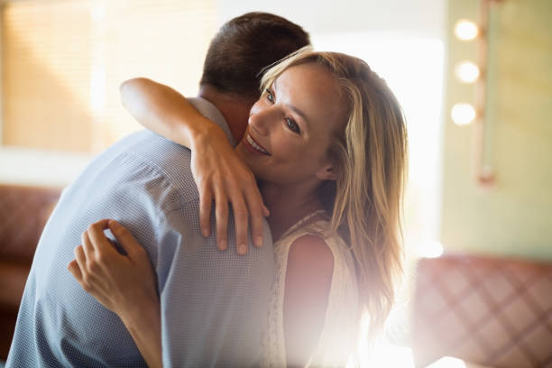 istock Couple embracing each other in restaurant 848955440