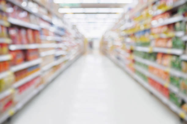 istock Empty Supermarket aisle shelves abstract blur defocused business background 848974156
