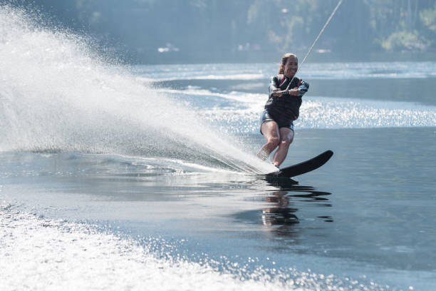 istock Beautiful woman waterskiing 848974270