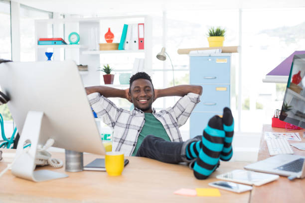 istock Male executive relaxing at his desk 848975110