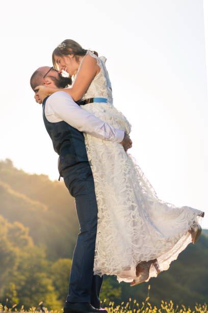 istock Groom holding bride in his arms 848977944