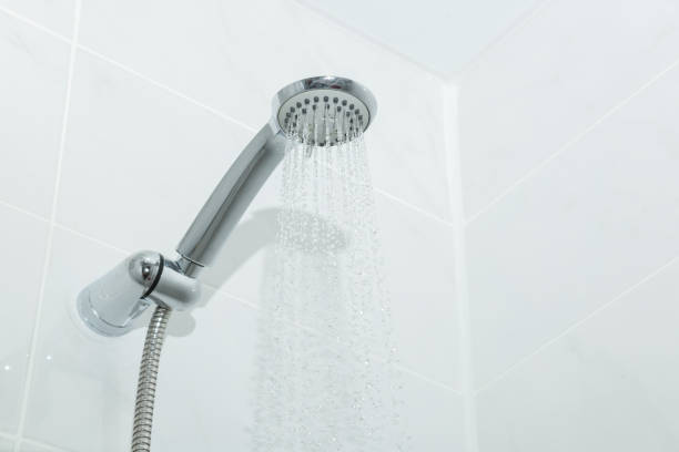 istock Working shower in the white bathroom. Close-up. 848985666