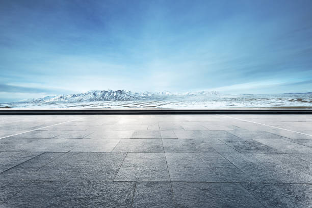 istock empty floor with beautiful snow mountains in blue sky 848997624