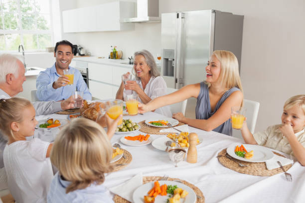 istock Family raising their glasses together 849011644
