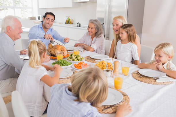 istock Father proposing a slice of turkey 849012098
