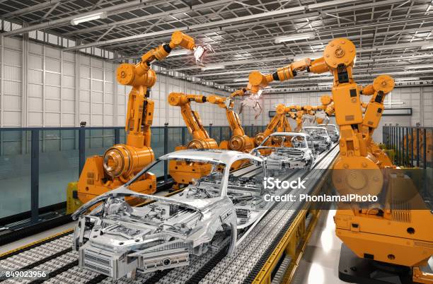 Línea De Montaje De Robot En La Fábrica De Automóviles Foto de stock y más banco de imágenes de Manufacturar