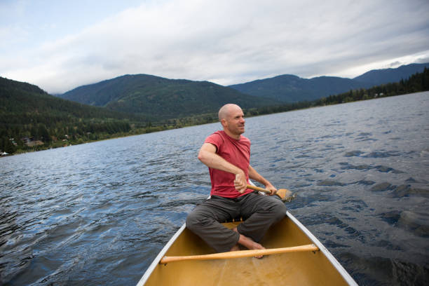 istock Male canoeing out on a lake 849031100