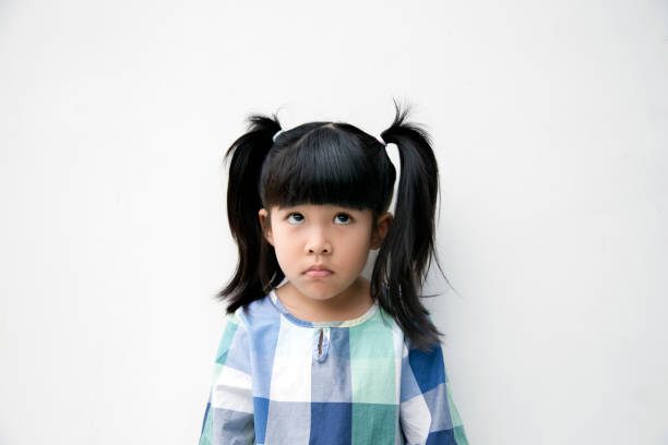 istock asian kid action boring look at left space 849037512