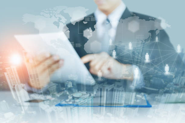 istock Businessman touch tablet with social network structure and world map with city skyscraper background 849038054