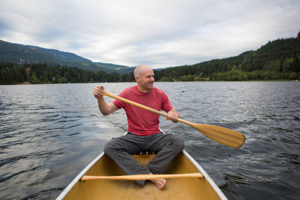 istock Male canoeing early in the morning 849038512
