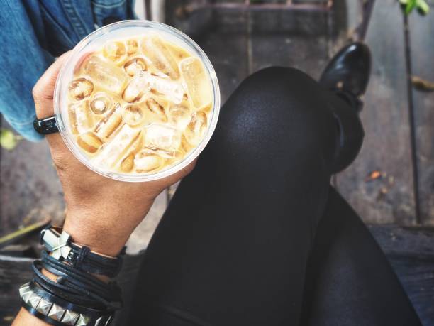 Woman drinking iced coffee