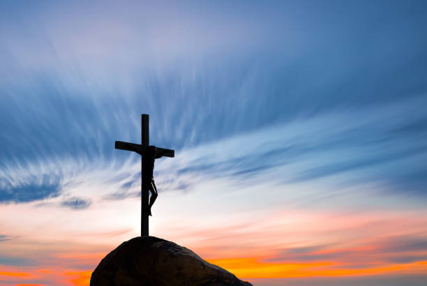 istock Jesus Christ on the cross over sunrise background 849078192