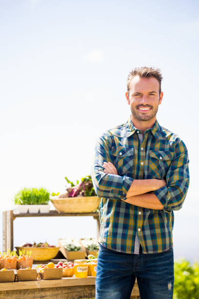 istock Portrait of confident man standing at farm 849078366