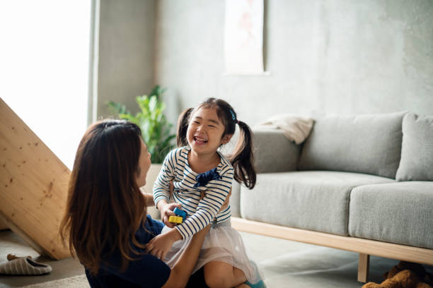 istock Mother and daughter playing together 849082194