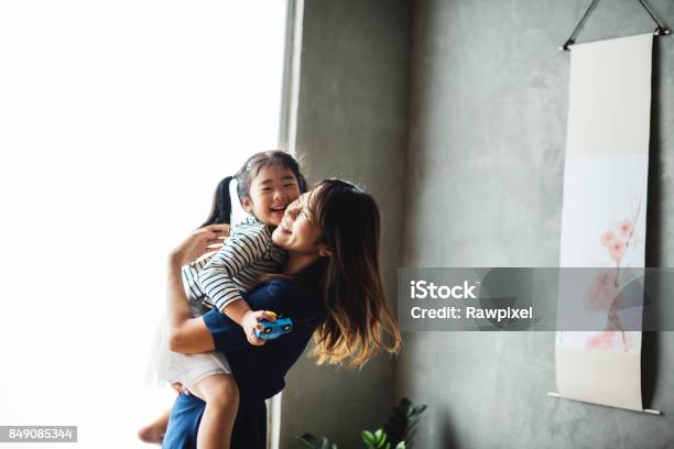 Grandparent Palying With Niece At Home Stock Photo - Download Image Now - Family, Mother, Child