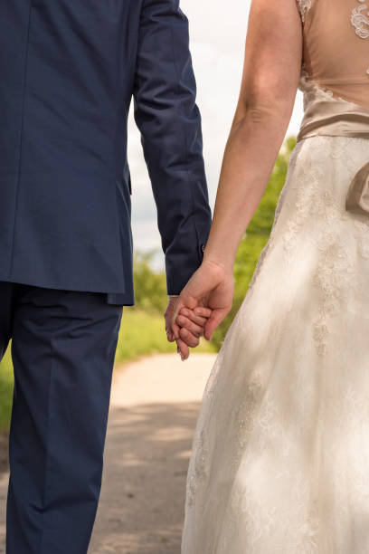 istock Walking wedding couple from behind 849085602