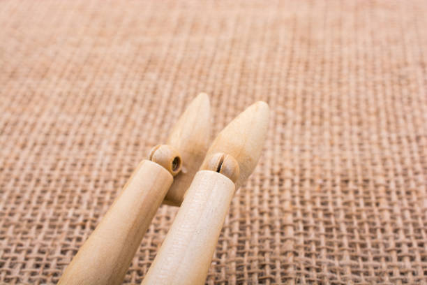 istock Wooden dolls posing with legs on canvas 849089508