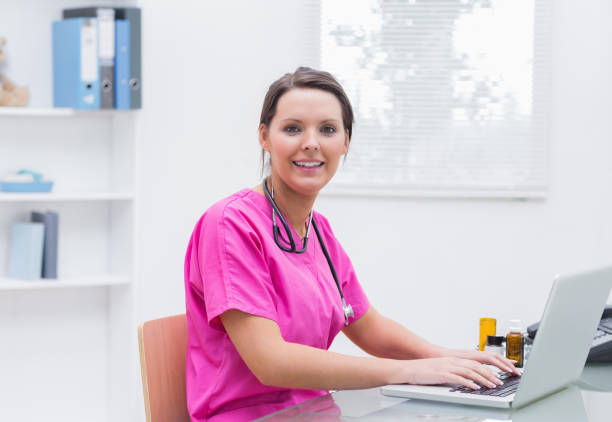 istock Portrait of smiling young nurse using laptop 849092798