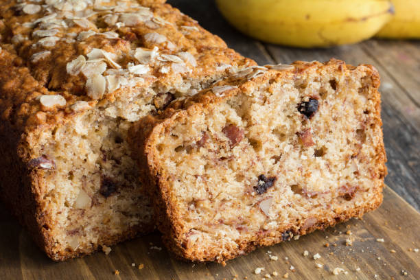 istock Sliced banana bread loaf with walnuts and oats 849097304