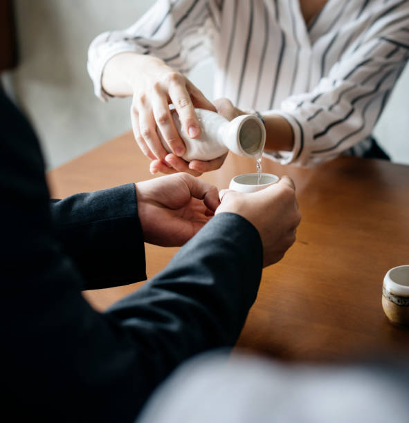 istock People pouring sake japanese alcohol drinking 849097826