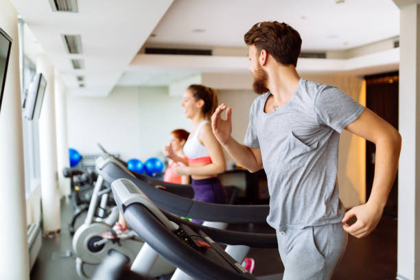 istock People running on treadmill in gym 849102392