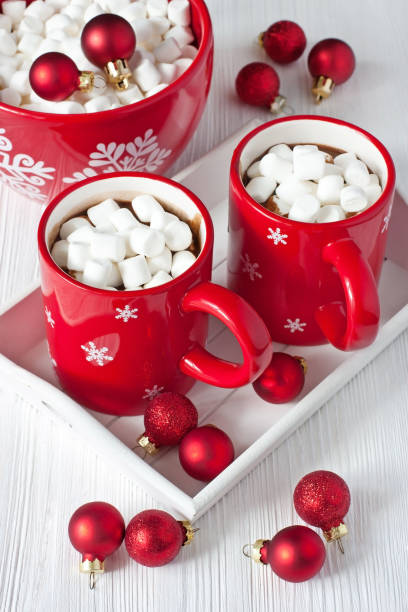 istock Red mugs with hot chocolate and marshmallows 849103248