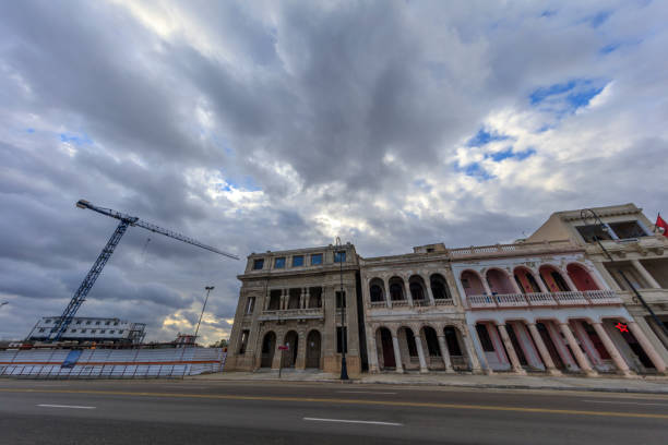Old Havana street view. Incidental people on the background. Residential buildings on the background.