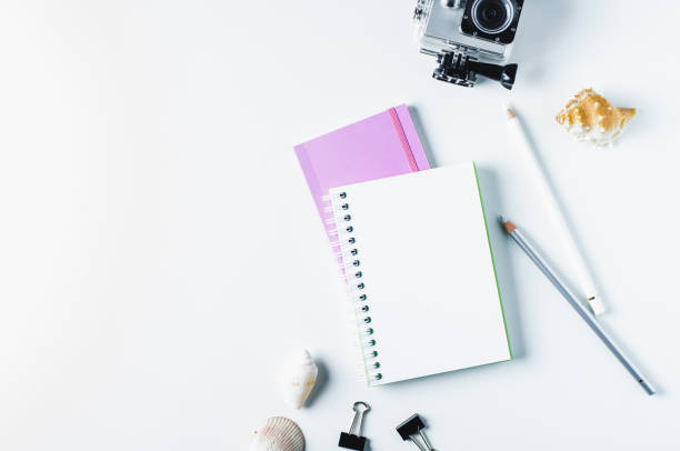 istock Action camera, shells and notebooks on a light background. The concept of memories or dreams 849125096