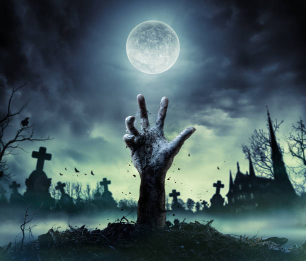 zombie hand rising out of a grave - cemetery halloween moon spooky imagens e fotografias de stock