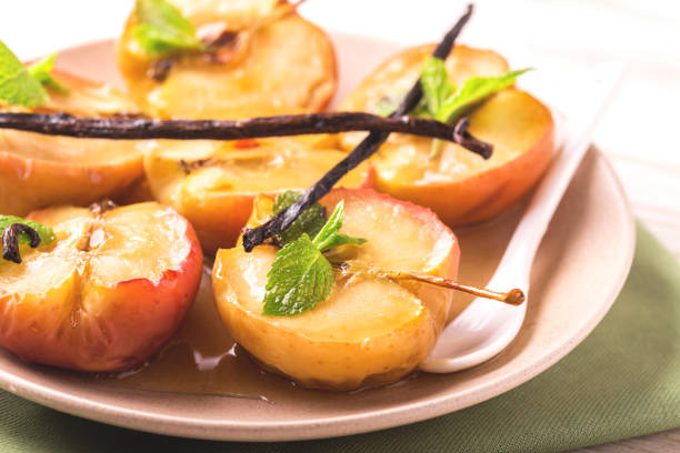 istock Baked red apples with vanilla syrop, mint and honey 849132160