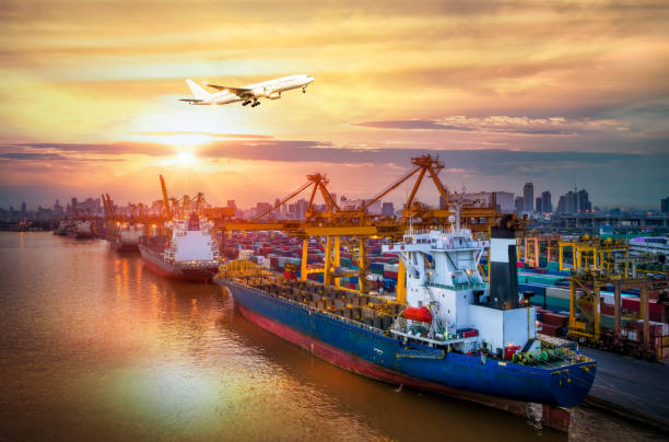 istock Logistics and transportation of Container Cargo ship and Cargo plane with working crane bridge in shipyard at sunrise 849132680