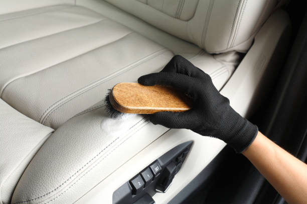 istock Car service. Worker washing of interior by a brush 849132766