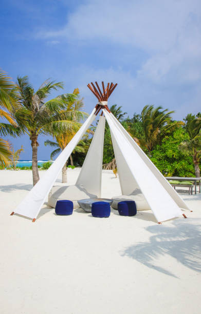 istock Tropical Beach with tent and bench 849136458