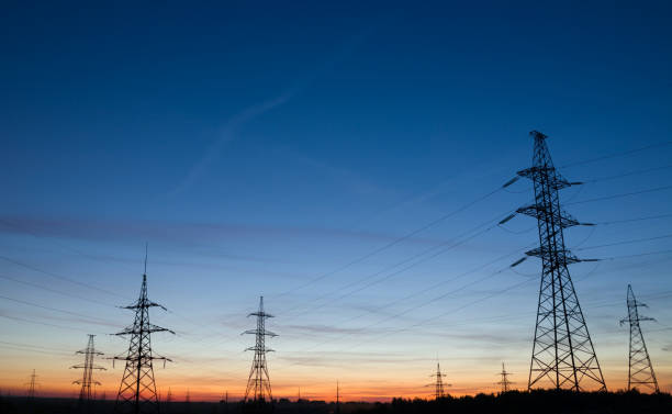 istock High voltage electricity pylons at beautiful sunset. 849137382