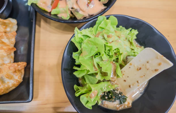 istock Fresh salad and mix vegetable in black plate 849140200