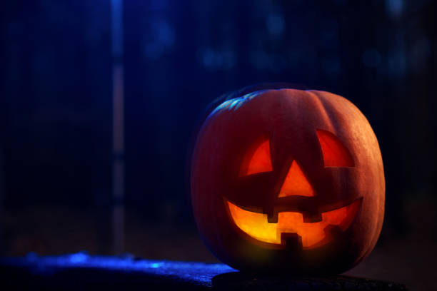 istock Scary red pumpkin with fire inside prepared for Halloween. 849140298
