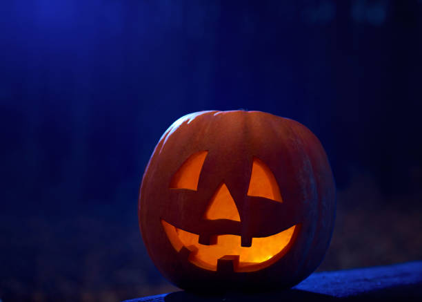 istock Orange pumpkin with fired big eyes and scary smile. 849140346