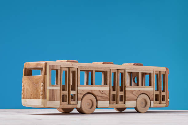 istock Wooden toy bus on blue background. 849146512