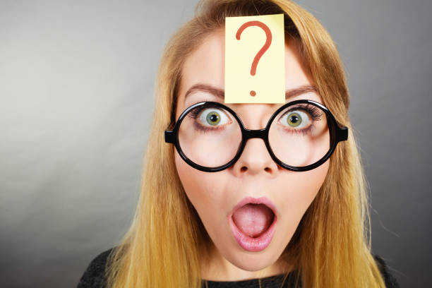 istock Weirdo nerd woman having question mark on forehead 849146732