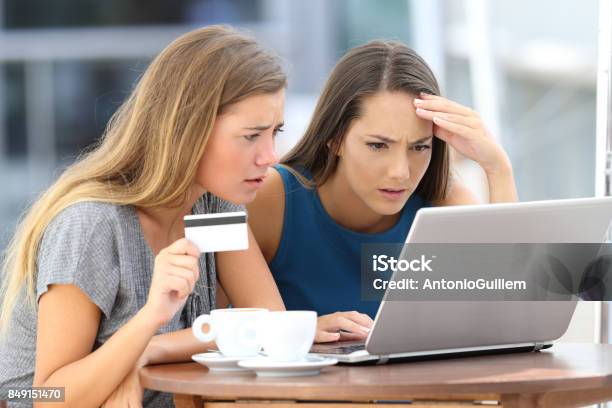 Worried Women Having Problem Buying On Line Stock Photo - Download Image Now - Dishonesty, Internet, Thief