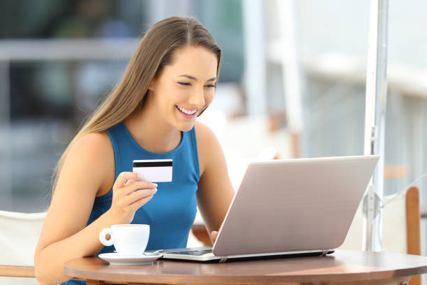 istock Happy woman paying on line in a restaurant 849157566