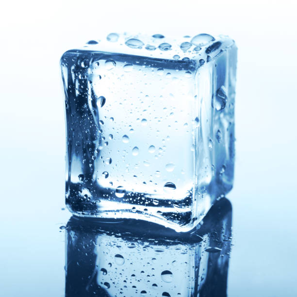 istock Transparent ice cube with reflection on blue glass with water drops 849158906
