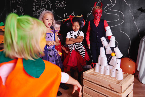 istock Kids taking part in halloween party 849161616