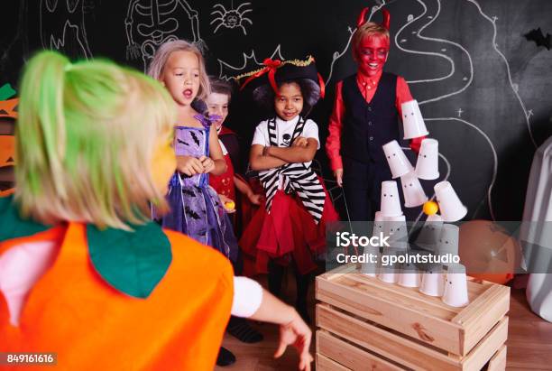 Kids Taking Part In Halloween Party Stock Photo - Download Image Now - Halloween, Leisure Games, Playing