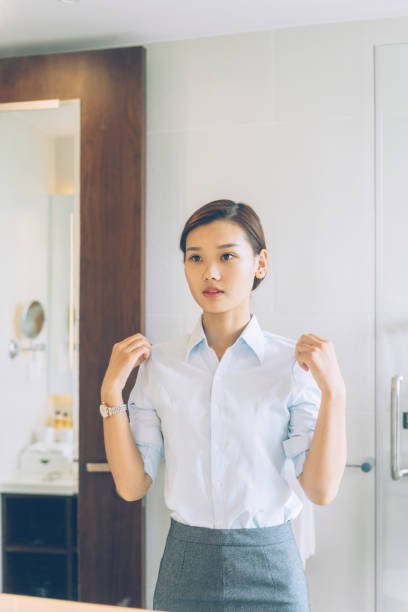 istock woman looking at mirror in the bathroom 849161632