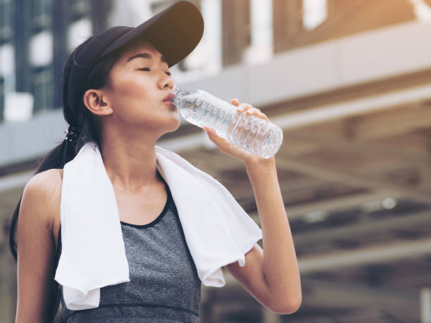 istock Sport woman with drinking water bottle 849161930
